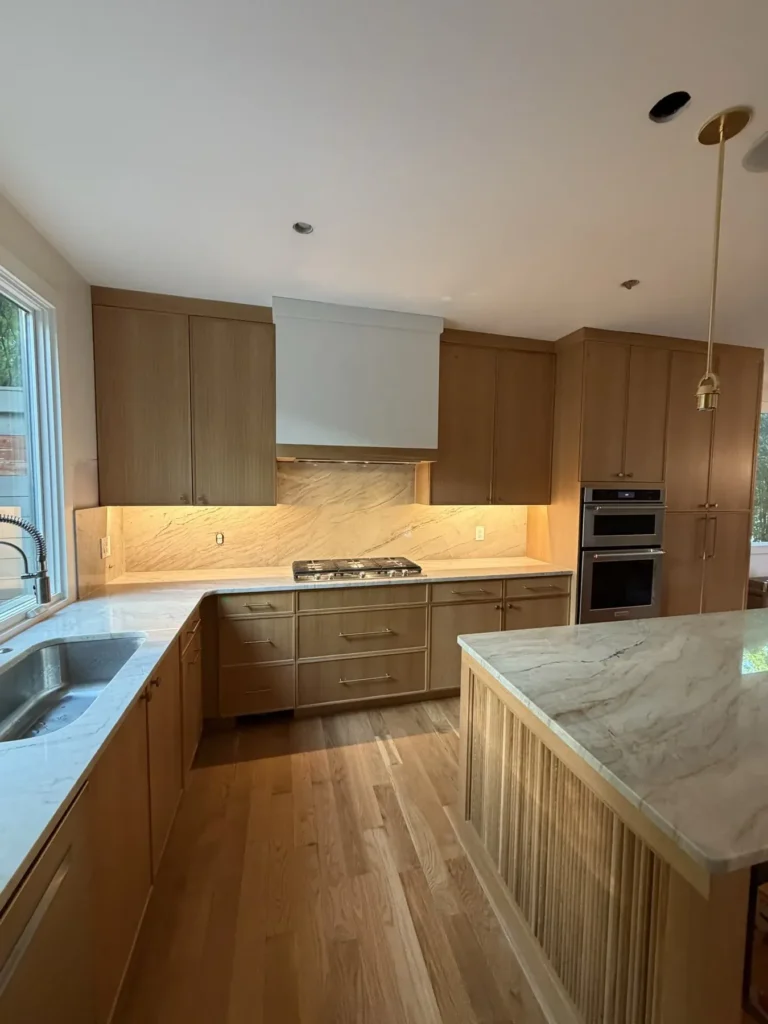 Custom kitchen remodel with quartz countertops and cabinetry by Buford Renovations